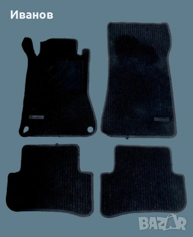Оригинален комплект от четири черни мокетни стелки за автомобил Mercedes-Benz. 