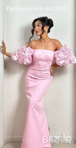 Официална рокля с обемни бухнали ръкави и декорация от перли по цялото тяло.