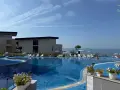 Нощувки в апартамент на частен плаж в гора с голям и малък басейн, снимка 1