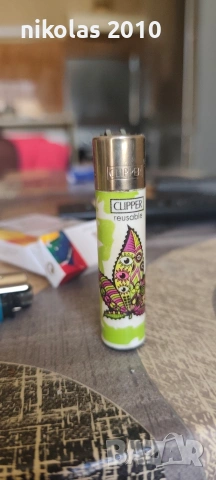 Колекция от 37 оригинални запалки Clipper + подарък дисплей (поставка), снимка 12 - Колекции - 54563525