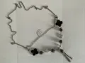Стилно многопластово сребърно колие с черни елементи във формата на детелина., снимка 1