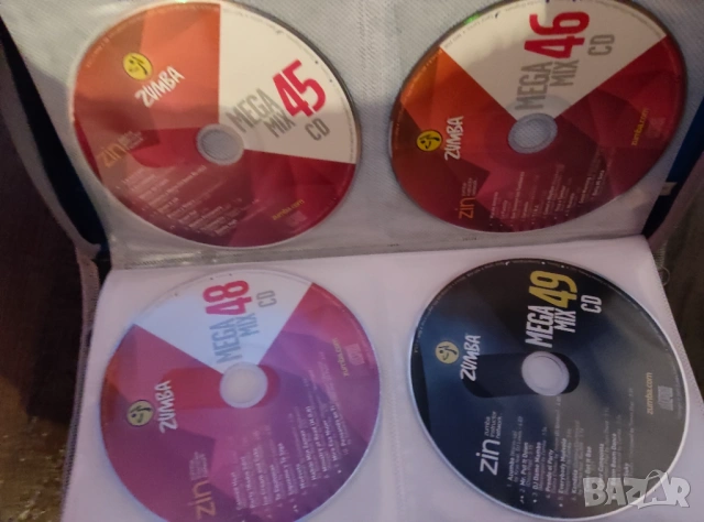 Оригинални Зумба дискове - 28 CD + 1 DVD (ZIN & Mega Mix), снимка 8 - CD дискове - 54110105