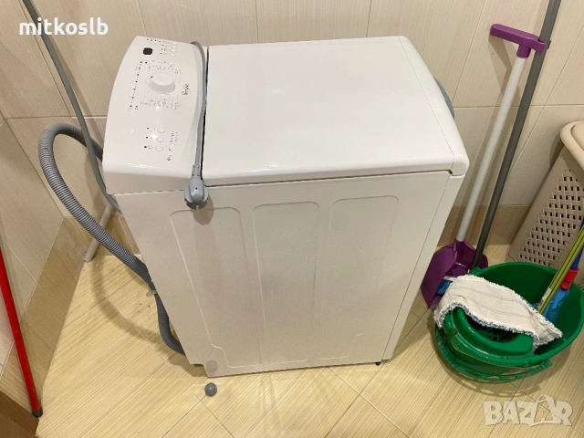 Пералня със горно зареждане 