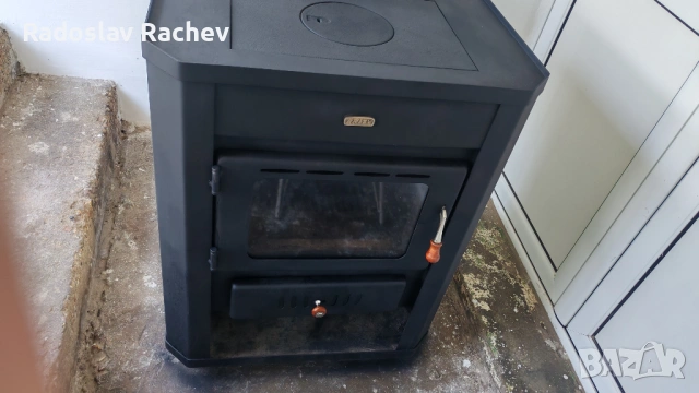 Продавам камина с водна риза 22kw. на дърва