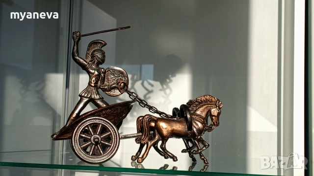 Римска колесница с войн,  символ на триумф, сила и решителност. 
