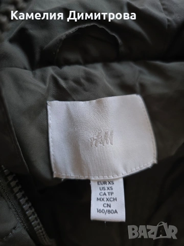 Дълъг пухен елек H&M XS | Маслиненозелен | Топъл | С качулка, снимка 6 - Елеци - 55172191