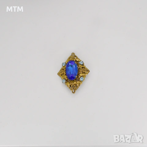 Брошка с голям син камък