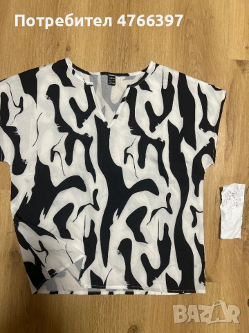 Елегантен потник тип блуза с черни мотиви