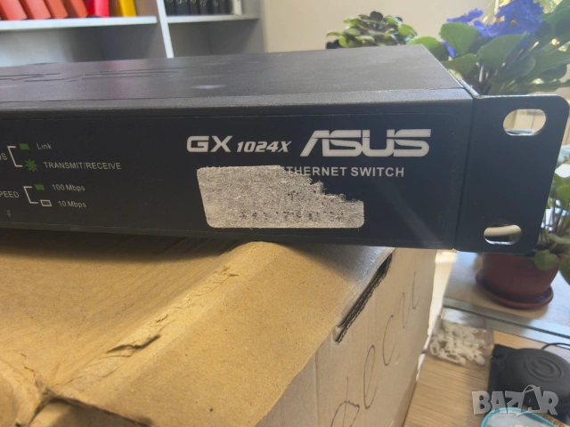 Продавам 24 портов 100мегабитов суич Asus GX1024x, снимка 2 - Суичове - 54595324