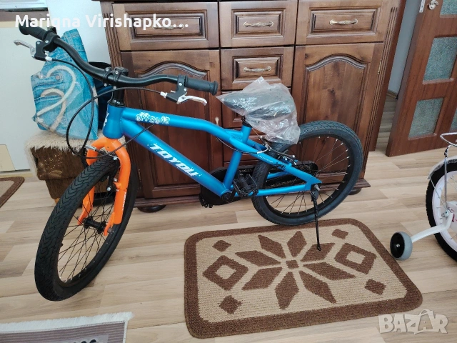 продавам детски велосипед със помощни гуми 