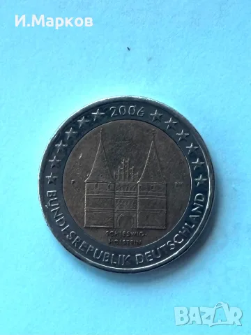 Възпоменателната монета от 2 евро от 2006 г. (Германия – „Schleswig-Holstein“ с портата Холстентор)