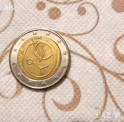 Германската възпоменателна монета от 2 евро от 2009 г. е посветена на „10 години Икономически и пари