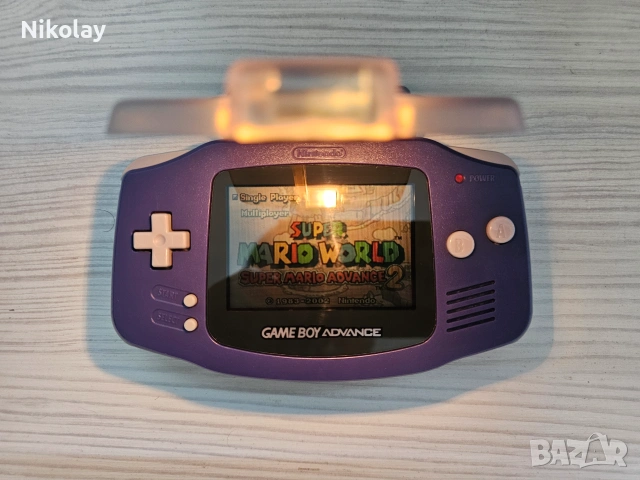 Nintendo Game Boy Advance + Super Mario World.