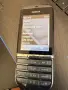 Nokia Asha 300 (познат още като Nokia 300 Touch and Type), пуснат на пазара през 2011 година, снимка 3