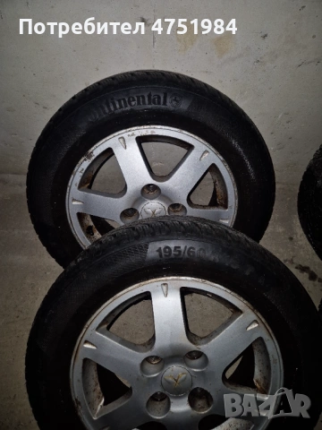 Оригинални лети джанти Mitsubishi 15" 4х114.3 със зимни гуми (Lancer, Colt), снимка 2 - Гуми и джанти - 54718818