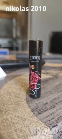 Колекция от 37 оригинални запалки Clipper + подарък дисплей (поставка), снимка 14 - Колекции - 54563525
