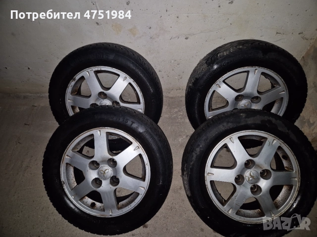 Оригинални лети джанти Mitsubishi 15" 4х114.3 със зимни гуми (Lancer, Colt)