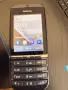 Nokia Asha 300 (познат още като Nokia 300 Touch and Type), пуснат на пазара през 2011 година, снимка 1