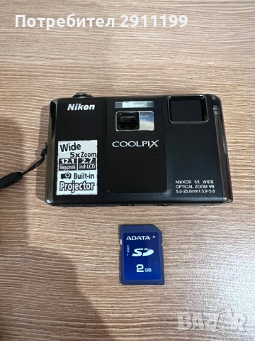 Фотоапарат Nikon 12.1Mp / Built-in Projector с подаръци, снимка 11 - Фотоапарати - 54625931