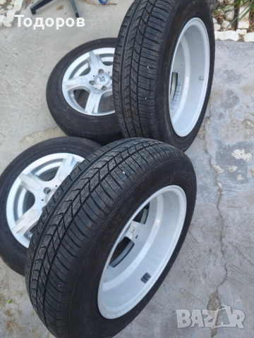 Лети джанти 14" 4x100 с централен отвор 60 mm, снимка 4 - Гуми и джанти - 54512677