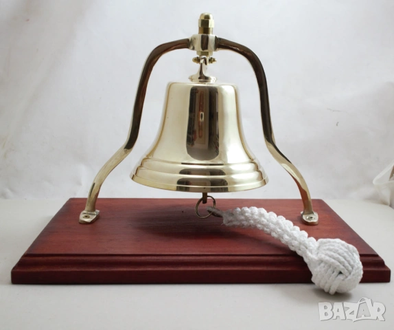 155 Камбана от плътен месиг,полирана на дървена поставка 