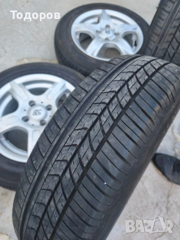 Лети джанти 14" 4x100 с централен отвор 60 mm, снимка 3 - Гуми и джанти - 54512677